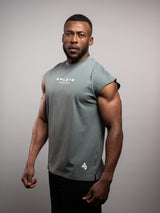 Model wearing the sage grey AFLETE workout tank top 014, tank top three quarter view
