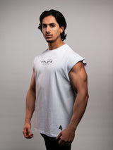 Model wearing the white AFLETE workout tank top 014, tank top side view