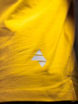 Yellow AFLETE workout tank top 014, hem logo close up
