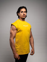 Model wearing the yellow AFLETE workout tank top 014, tank top three quarter view