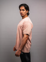 Model wearing the clay pink AFLETE Washed Essential oversized T-shirt 015, tshirt right side view