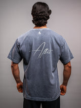 Model wearing the grey ash AFLETE Washed Essential oversized T-shirt 015, tshirt back view