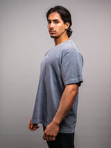 Model wearing the grey ash AFLETE Washed Essential oversized T-shirt 015, tshirt right side view