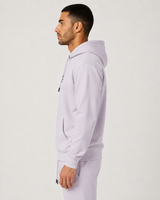 Model wearing the mauve AFLETE Urban hoodie 016, hoodie side view
