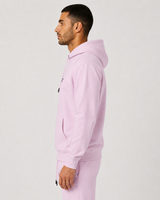 Model wearing the rose pink AFLETE Urban hoodie 016, hoodie side view