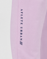 Model wearing the rose pink AFLETE Urban joggers 017, joggers back view