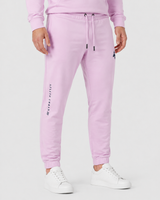 Model wearing the rose pink AFLETE Urban joggers 017, joggers side view