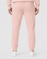 Model wearing the salmon AFLETE Urban joggers 017, joggers back view