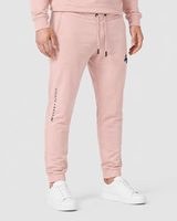 Model wearing the salmon AFLETE Urban joggers 017, joggers three quarter view