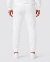 Model wearing the white AFLETE Urban joggers 017, joggers back view