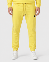 Model wearing the yellow AFLETE Urban joggers 017, joggers front view