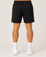 Model wearing the black AFLETE Core cotton shorts 018, shorts back view