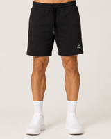 Model wearing the black AFLETE Core cotton shorts 018, shorts front view