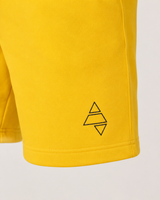 Yellow AFLETE Core cotton shorts 018, thigh logo close up